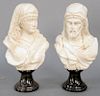 Pair of Italian Marble Busts, each white marble, bearded man and a woman partially clad wearing headdress, on conforming black granite socles. height 