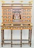 Spanish Vargueno Cabinet on Stand, block front with pierced ornate ormolu gallery with eagle finials over central door with columns flanked by eight d