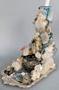Grotto Rock Crystal Sculpture Candlestick, having amethyst, rock crystal, semi precious stones, birds and turtle figures on a plated tray in the mann