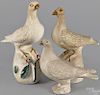 Pair of chalkware doves, ca. 1900, on a foliate a