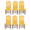 Lote de 6 sillas. Francia. Siglo XX. En talla de madera de roble. Con respaldos cerrados y asientos acojinados en tapicería amarilla.