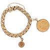 WRISTBAND AND PENDANT WITH DEMONETIZED COIN. 21.6K, 14K AND 10K YELLOW GOLD
