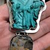 A VINTAGE TURQUOISE CHINESE FIGURE SILVER PENDANT. AKR? MARK