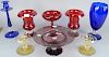 Eight piece Pairpoint glass group, all having controlled bubble ball stems, Amethyst compote, pair of Canaria short candlesticks, tall blue candlestic