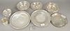 Nine piece sterling silver lot with plates and cups. 37.8 t.oz