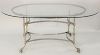 Custom French oval glass top table, with iron base. ht. 29 1/2 in., top 46 1/2" x 72 1/2".