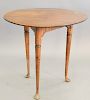 Queen Anne tavern table, with round top on turned legs ending in pad feet (restored top), ht. 25 1/2in., dia. 26 3/4in.