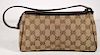 Small Gucci Wristlet in Monogrammed Canvas