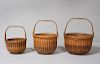 NEST OF THREE NANTUCKET BASKETS WITH SWING HANDLES