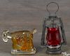 Spark Plug painted glass candy container, 20th c., 3'' h., together with a painted barn lantern