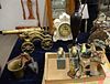 Group lot to include heavy brass dragon canon, cat door stop, two iron basket flowers, two pairs of book ends, bull and bear, Maitland Smith urn and a