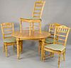 Five piece pine round table with four chairs. ht. 29 1/2 in., dia. 50 in. Provenance: Former home of Mel Gibson, Old Mill Rd, Greenwich, CT
