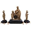 Adornments. France. 20th Century. Figures in golden metal on stone base. Golden bronze clock with Roman numbers.