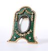 A SMALL DIAMOND AND ENAMEL PHOTOGRAPH, IN FABERGE STYLE, with arch top, the