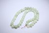 A STRING OF JADE BEADS, the forty-nine beads slightly graduating. Approx. 6