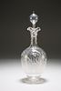 AN EDWARDIAN ETCHED GLASS DECANTER, the ball stopper over a triple spout , 