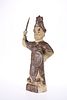 A CHINESE EARTHENWARE FIGURE, the hollow figure modelled holding a shield a