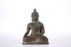 AN 18TH CENTURY BRONZE BUDDHA, seated in contemplative pose, wearing robes.