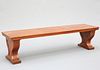 A REGENCY MAHOGANY AND OAK HALL BENCH, raised on fluted lyre-shaped trestle
