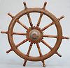 A LARGE HARDWOOD SHIP'S WHEEL OF OVER 5-FOOT DIAMETER, with ten fluted spok