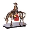 A mixed metal sculpture of a horseman.