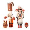 Two kachina dolls and two Mexican terra cottas.