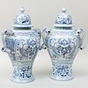 Pair of Delft Style Blue and White Urns and Covers