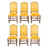 Lote de 6 sillas. Francia. Siglo XX. En talla de madera de roble. Con respaldos cerrados y asientos acojinados en tapicería amarilla.