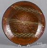 Slip decorated redware plate, 19th c.