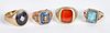 Four 10K gold and gemstone rings, 24.2 dwt.