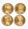 Four Helvetia 20 Franc gold coins.