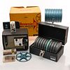 8 MILLIMETER HOME MOVIE PROJECTOR AND REELS