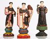 A Group of Three Carved Hardwood Santos Figures with Polychrome Decoration, Early 20th Century.