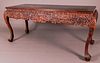 A Chinese Heavily Carved and Stained Hardwood Console Table, 20th Century.