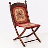 A Victorian Oak and Needlework Traveling Chair, 20th Century.