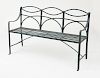 REGENCY STYLE GREEN-PAINTED WROUGHT IRON THREE SEAT GARDEN BENCH