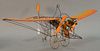 Model airplane, wire frame, orange cardboard wings, wooden pilot figurine, "Earl 78" on rudder, light wear and minor damages, ht. 12 1/2", wd. 22" x d