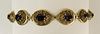 Lady's Vintage 14 Karat Filigree Yellow Gold and Oval Cut Garnet Bracelet