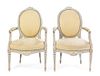 A Pair of Louis XVI Style Cream Painted Fauteuils Height 37 1/2 inches.