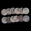Twelve Chinese emperor coins.