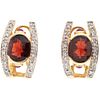 PAIR OF EARRINGS WITH GARNETS, RUBIES, AND DIAMONDS IN 14K GOLD with 2 garnets, 4 rubies and 24 diamonds. Weight: 8.5 g