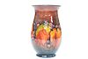 WILLIAM MOORCROFT
 A LARGE "LEAF AND BERRY" FLAMBE VASE, CIRCA 1928, with f