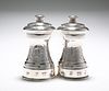 A PAIR OF SILVER PEPPER GRINDERS, ROBERTS & BELK, LONDON 1979, the waisted 