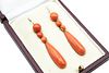 A PAIR OF CORAL DROP EARRINGS 
 Each graduated line of cabochon coral coral