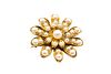A PEARL FLOWER BROOCH 
 The realistically modeled flowerhead, with a centra