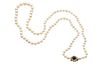 A CULTURED PEARL NECKLACE WITH A SAPPHIRE AND DIAMOND CLASP
 The single str