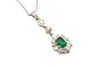 AN EMERALD AND DIAMOND PENDANT NECKLACE
 The claw-set octagonal-cut emerald
