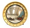 A LARGE REGENCY GILT-COMPOSITION CONVEX MIRROR, with applied balls. 63cm di