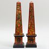 Pair of Decalcomania Decorated Red Painted Stone Obelisks 