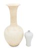 Two White Glazed Anhua Decorated VasesHeight of taller 17 in., 43.2 cm.